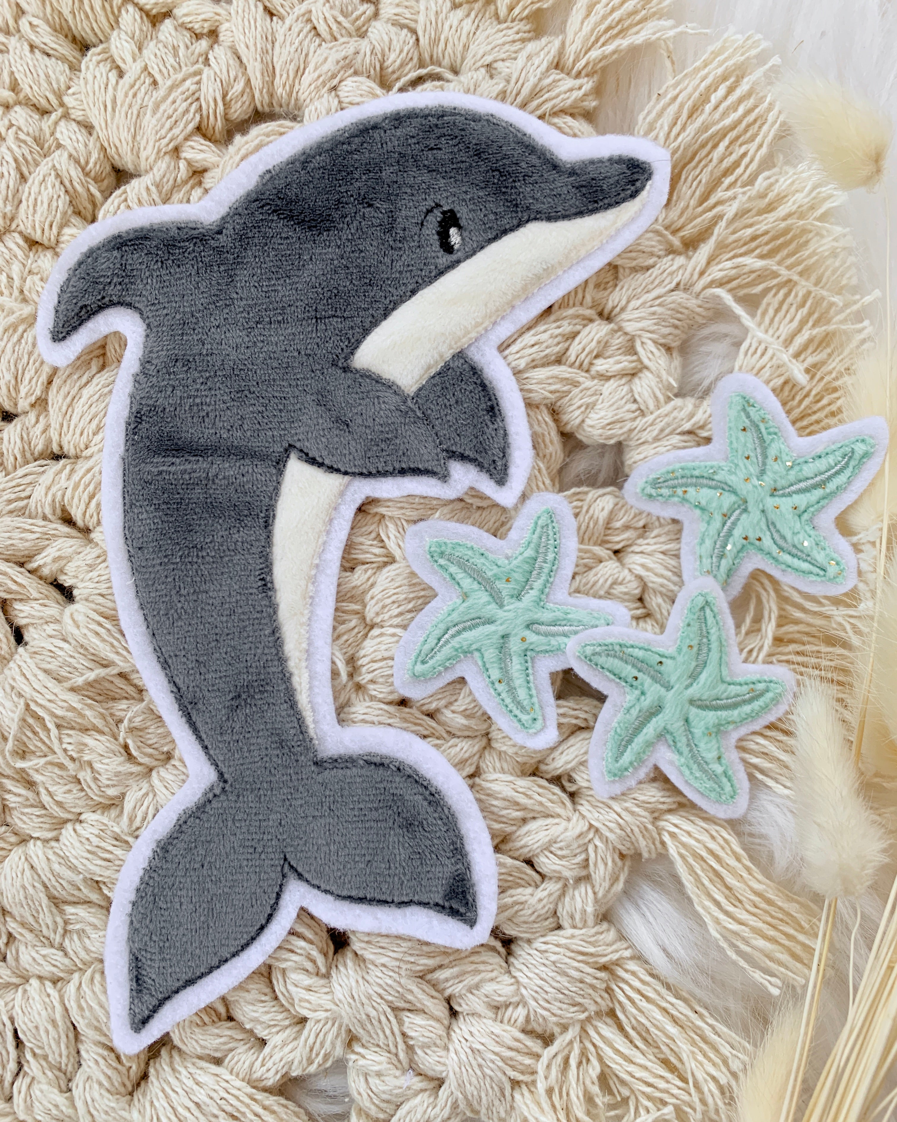 Applikation Delfin und Seesterne