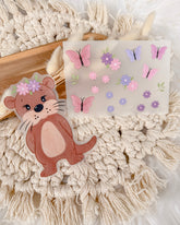 Otter mit Blumen aufbügelbar