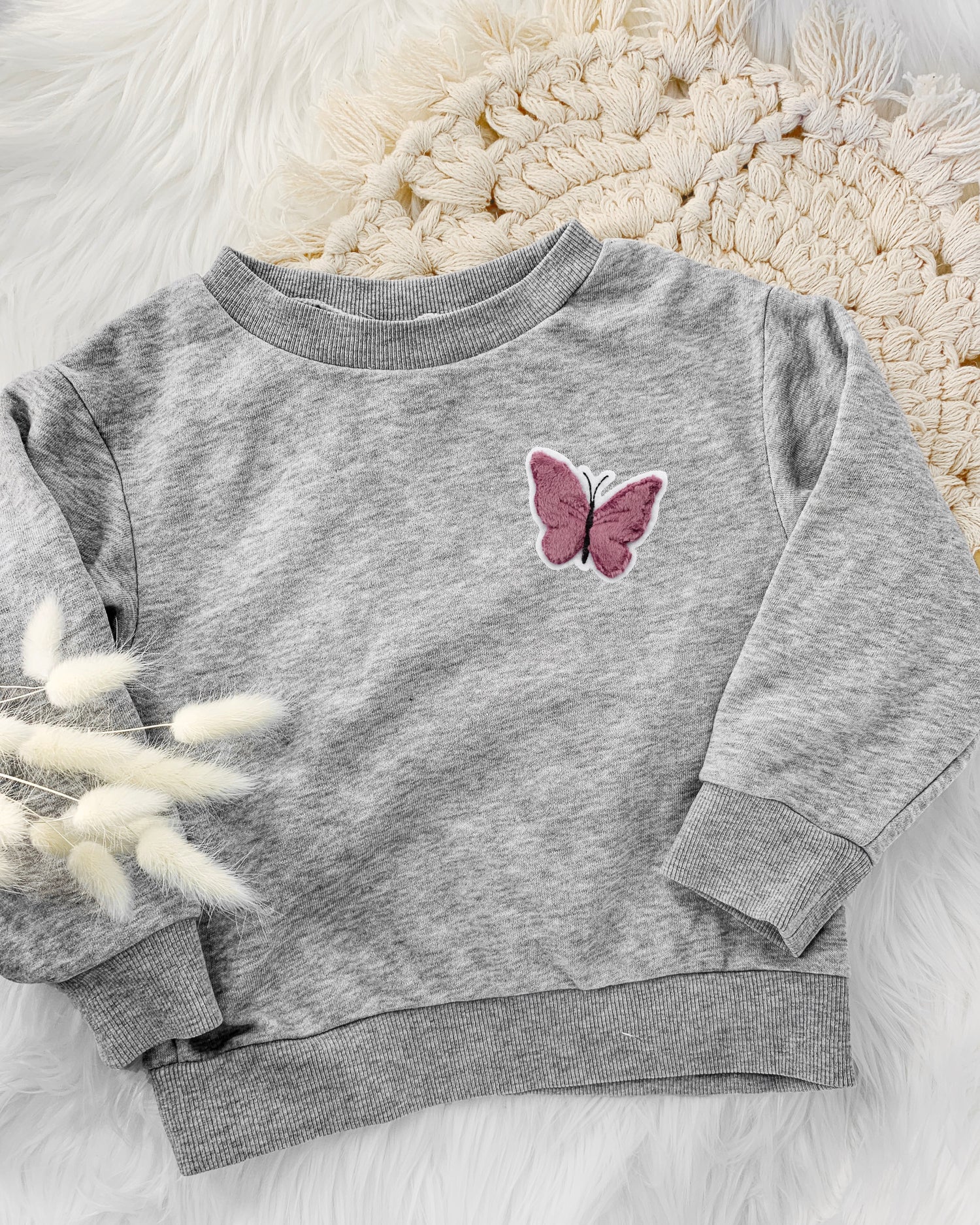 Applikation Schmetterling auf Pullover